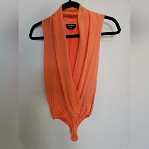 Bebe bodysuit top size S. Orange beautiful and flirty